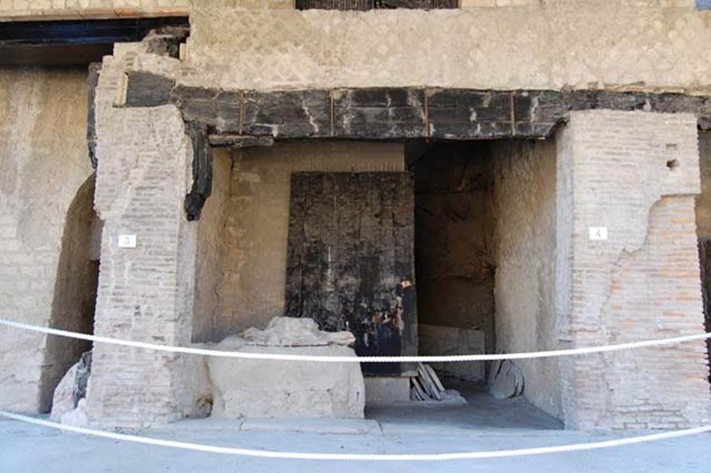 Decumanus Maximus, Herculaneum. May 2006. Carbonised wood on east side of doorway. 
Photo courtesy of Nicolas Monteix.
