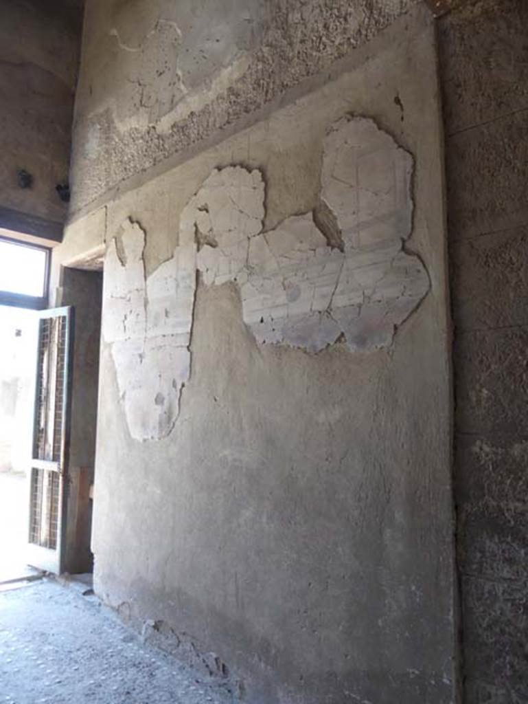 III.11, Herculaneum, June 2017, Room 1, painted decoration on south wall of entrance corridor, looking east.  Photo courtesy of Michael Binns.
