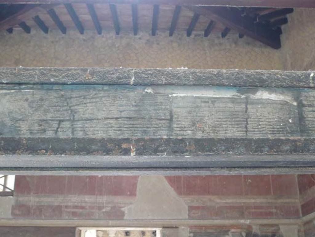 III.11 Herculaneum. August 2013. Room 6, carbonized wood above screen/partition.
Photo courtesy of Buzz Ferebee.
