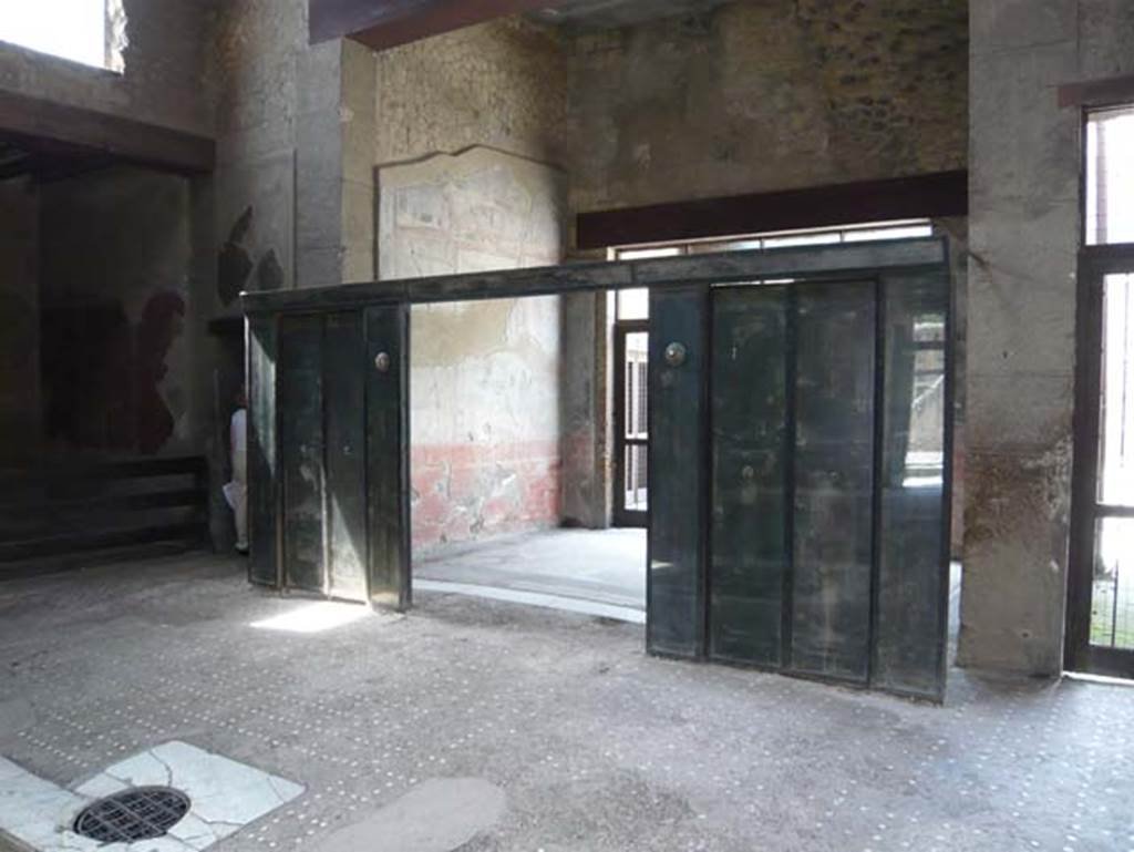 III.11 Herculaneum. May 2009. Room 6, looking south-west. Wooden partition in atrium which would have given more privacy to the tablinium.  Photo courtesy of Buzz Ferebee.
