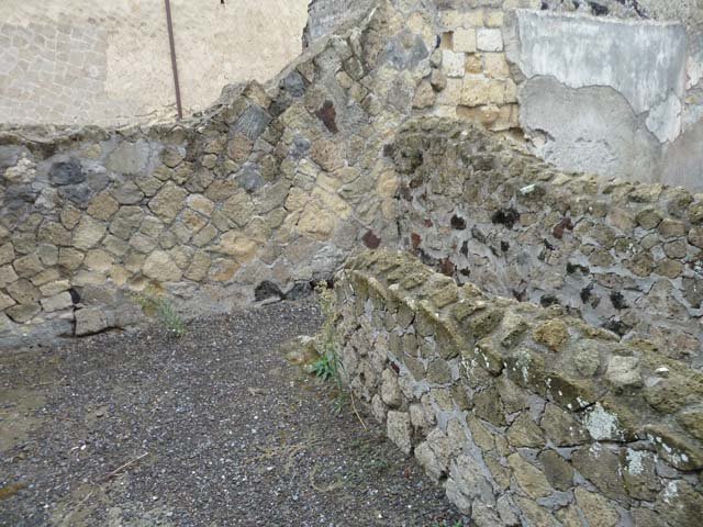 IV.8, Herculaneum, September 2015. Room 3, looking towards north wall, and with separate area or small room, on right. According to Pesando and Guidobaldi, in the north-west corner would have been the channel for the discharge pipe from the latrine above on the upper floor.
