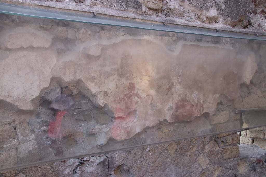 IV.17, Herculaneum, September 2019. 
Looking towards a different figure still visible on the south wall behind the sales counter. Photo courtesy of Klaus Heese.
