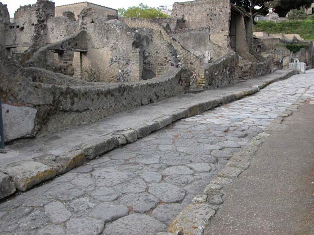 Cardo V, Inferiore, west side, Herculaneum. May 2004. Looking north-west towards entrances of IV.18, and IV.17.
Photo courtesy of Nicolas Monteix.
