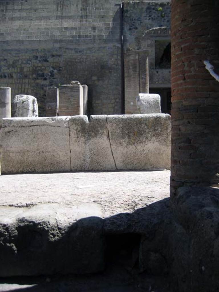 Looking north on Cardo IV, to drainage beneath junction with Decumanus Maximus, Herculaneum. 
June 2011. Photo courtesy of Sera Baker.
