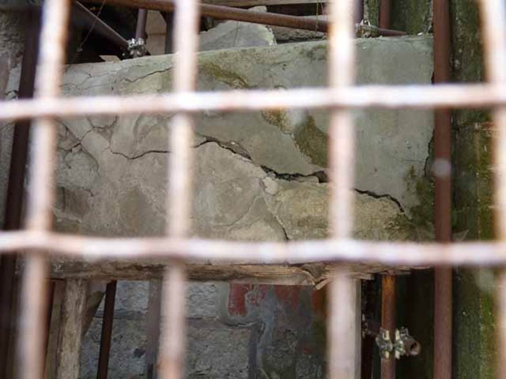V 14, Herculaneum, May 2010. Doorway 14, collapsing wall above frail wooden doorframe.