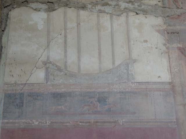 V. 35, Herculaneum, September 2015. Triclinium 1, detail from panel at west end of north wall.  Photo courtesy of Michael Binns.
