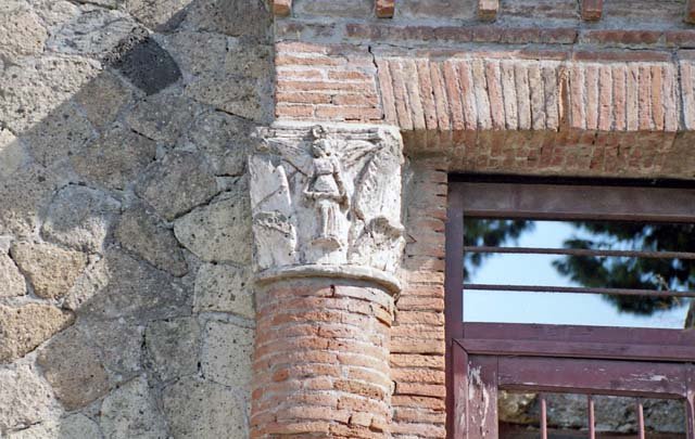 V,35 Herculaneum. October 2001.  Detail of Corinthian capital adorned with winged Victory set in the half brick columns. Photo courtesy of Peter Woods.
