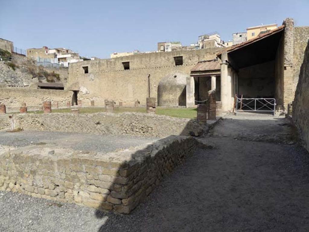 VI.5, Herculaneum. October 2014. Central Baths, doorway leading to open-exercise area, at front of photo.  Photo courtesy of Michael Binns.
