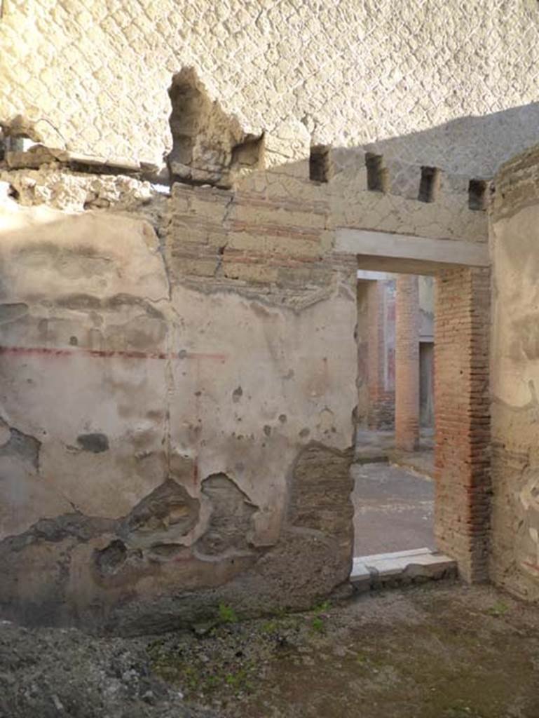 VI.28 Herculaneum, August 2021. 
Looking towards east wall with doorway to atrium, and south wall, on right. Photo courtesy of Robert Hanson.
