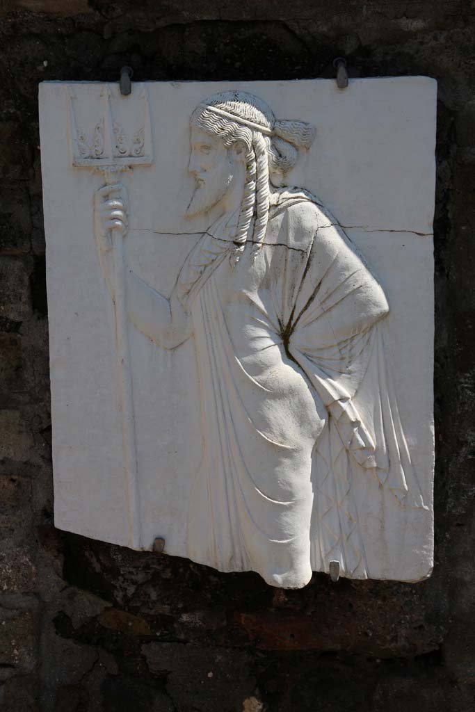 Herculaneum, April 2018. Reproduction relief of Vulcan, from the shrine of Four Gods on the Sacred Area terrace. Photo courtesy of Ian Lycett-King. Use is subject to Creative Commons Attribution-NonCommercial License v.4 International.
