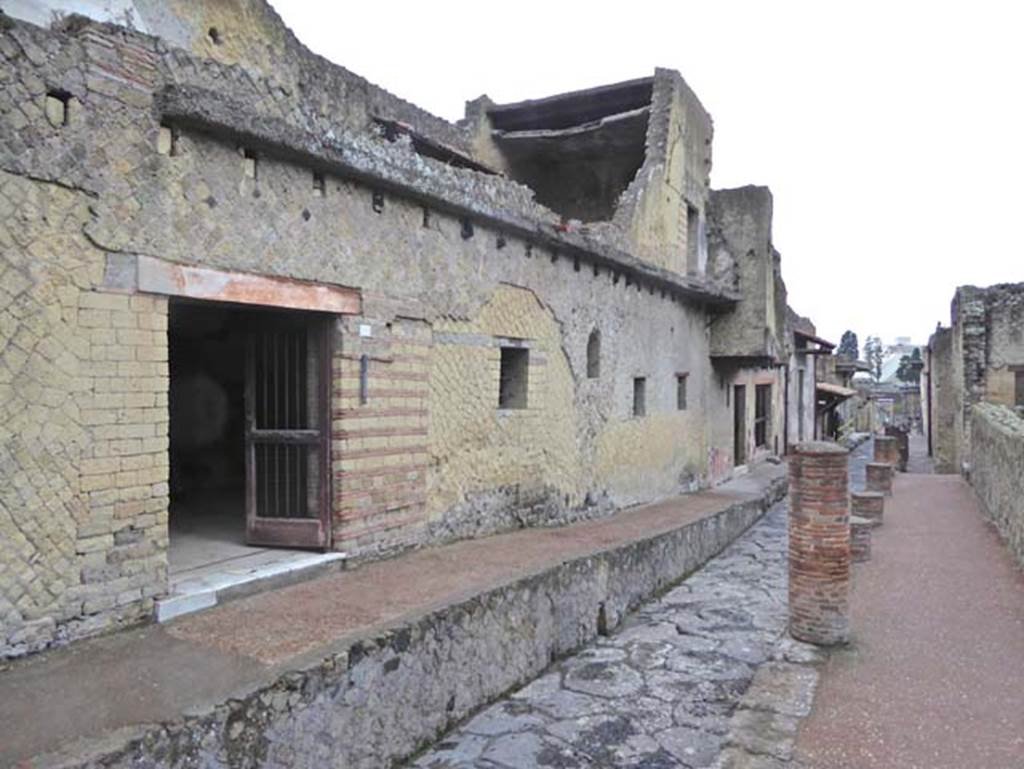 Cardo IV, east side, Herculaneum. October 2015. Looking south to entrance doorway at V.8, to Casa del Bel Cortile. 
Photo courtesy of Michael Binns.

