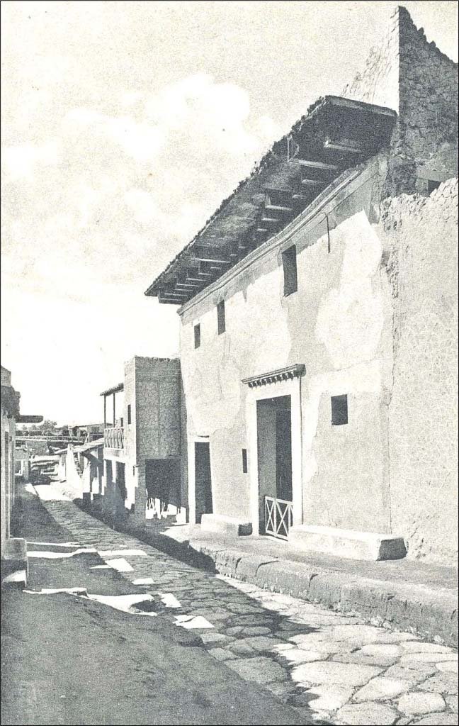 Cardo IV Inferiore, Herculaneum. Undated postcard entitled “Prospetti di edifici”.
Looking south towards front façade of III.11 (Casa del Tramezzo di Legno or House of the Wooden Screen), on right. 
Photo courtesy of Peter Woods.
