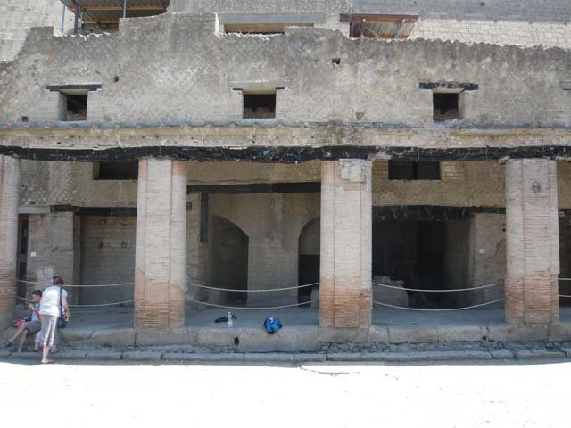 Decumanus Maximus, Herculaneum, May 2006. Looking towards lower and upper floors of no. 3, centre right.
Photo courtesy of Nicolas Monteix. 
