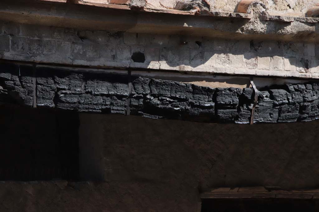 Decumanus Maximus, Herculaneum. October 2020. Detail of carbonised wood from doorway numbered 2. Photo courtesy of Klaus Heese.