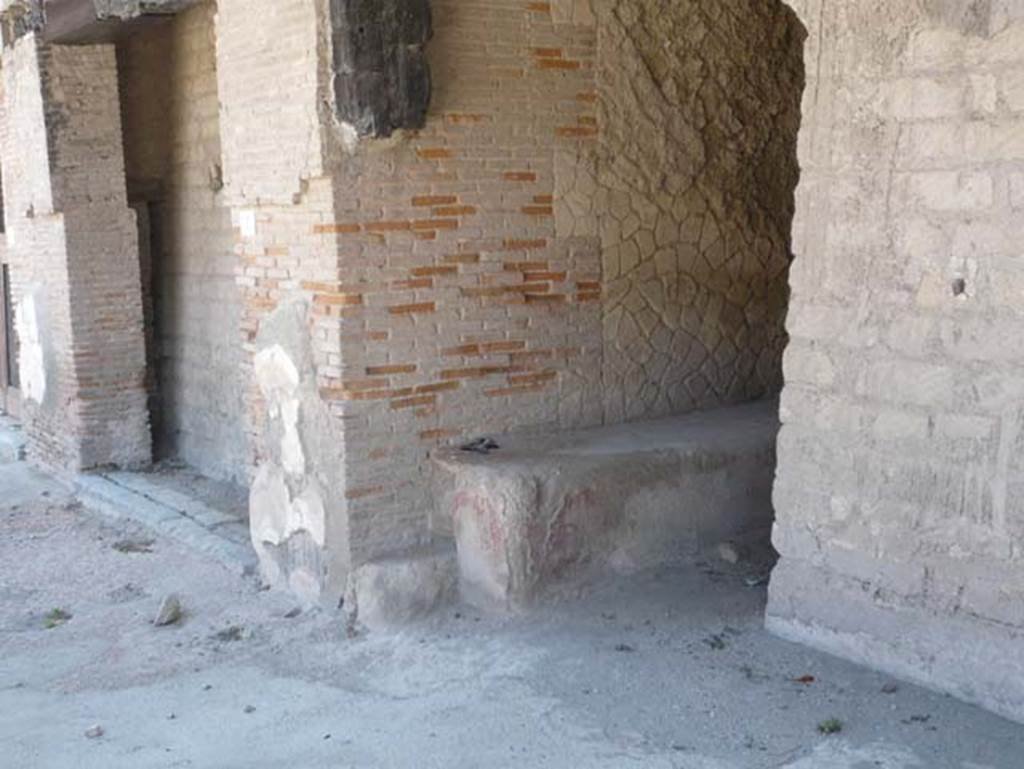 Decumanus Maximus, Herculaneum. August 2013. Looking west along north side, with bench in doorway numbered 4. Photo courtesy of Buzz Ferebee.
