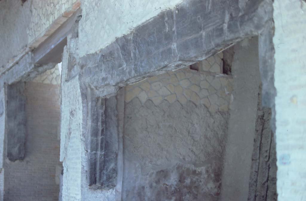 Decumanus Maximus, Herculaneum. May 2006. Carbonised wood from west side of doorway numbered 4.
Photo courtesy of Nicolas Monteix.

