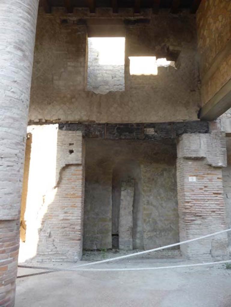 Decumanus Maximus, Herculaneum, July 2015.   Building on north side of the Decumanus Maximus, doorway and upper floors, numbered 5.  Photo courtesy of Michael Binns.

