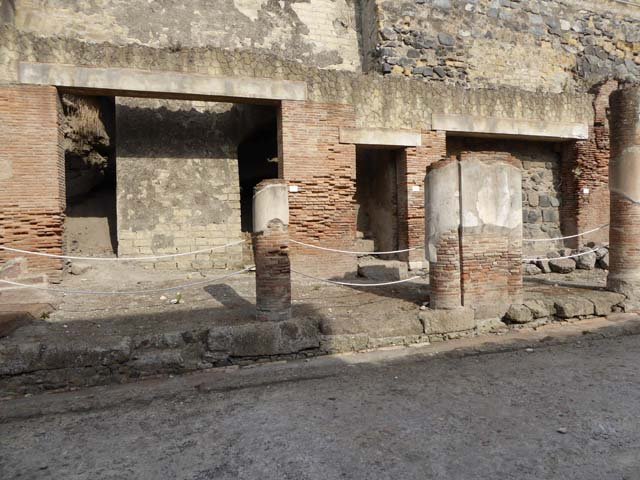 Decumanus Maximus, Herculaneum, October 2014.  Building on north side of the Decumanus Maximus, doorway numbered 8, on left, number 9, centre right, and number 10, on right.  Photo courtesy of Michael Binns. 
