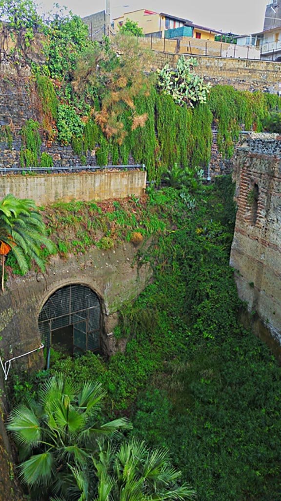 II.1 Herculaneum, on right. Photo taken between October 2014 and November 2019.
Looking west from access bridge. Photo courtesy of Giuseppe Ciaramella.

