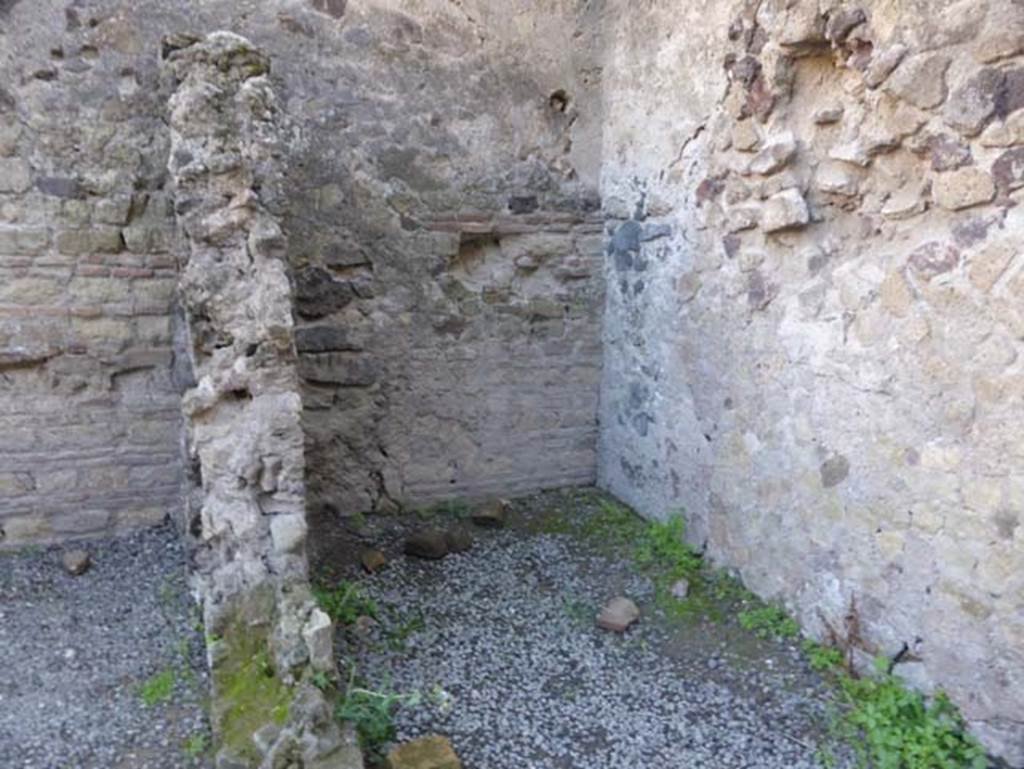 II.6/7 Herculaneum, September 2015. Looking east into second of the two rear rooms. 
According to the guidebook – in the rear rooms of this bar, many amphorae were found. One of them showed a painted inscription of a Herculaneum maker, with the wording  – M. Livi Alcimi Herclani.
See Guidobaldi, M.P, (2009). Ercolano: guida agli scavi. Napoli, Electa, (p.56)
