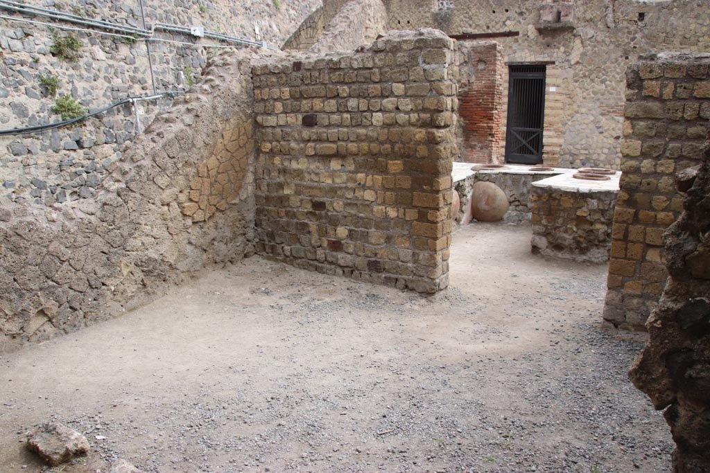 II.6/7 Herculaneum, May 2024. 
Looking towards north-west across first rear room, into bar-room and entrance at II.7. Photo courtesy of Klaus Heese. 
