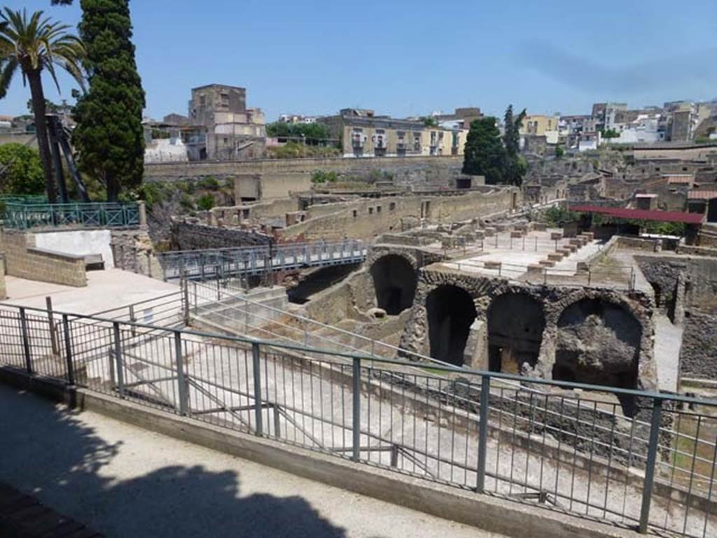 III.1/2/18/19, Herculaneum, June 2012. Looking north from access roadway towards upper and lower rooms, on right. Note the access bridge now leads to the southern part of the roadway at Cardo III. Photo courtesy of Michael Binns.

