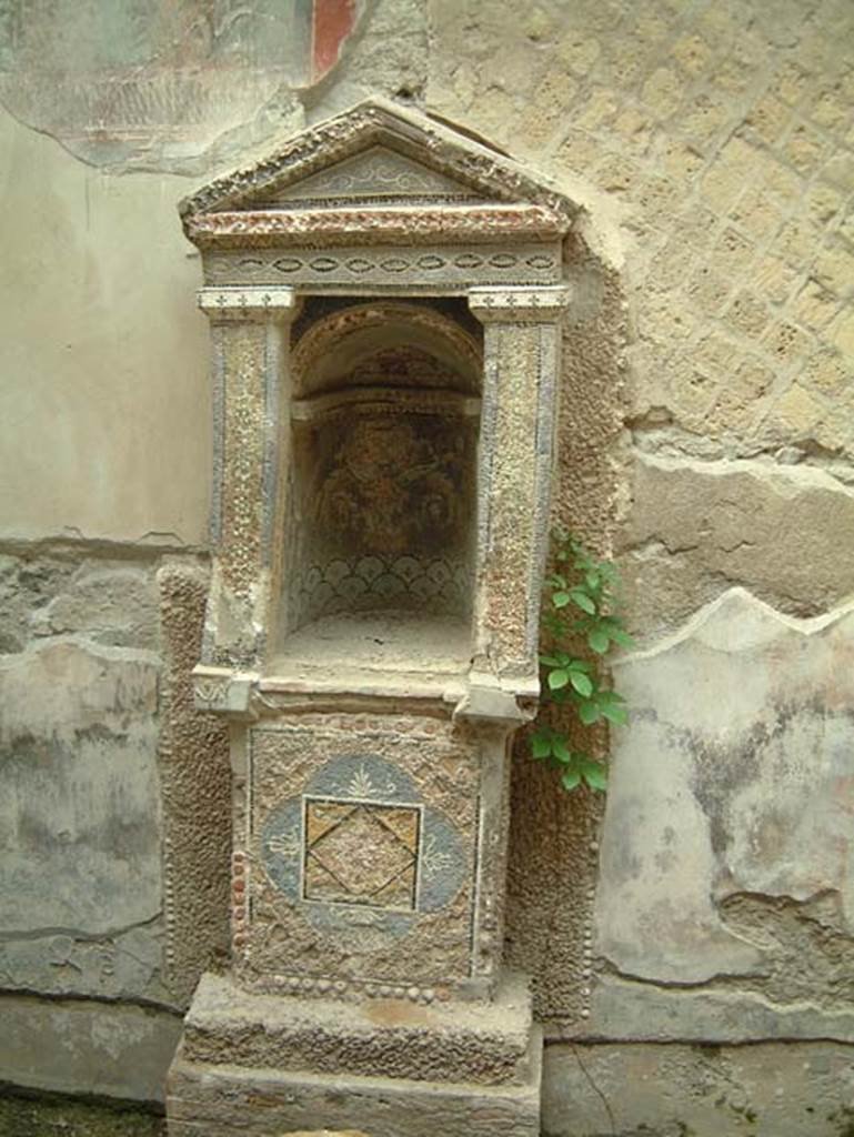 III.3 Herculaneum, May 2001. Mosaic and shell-trimmed aedicula built on a high podium.  Photo courtesy of Current Archaeology.
