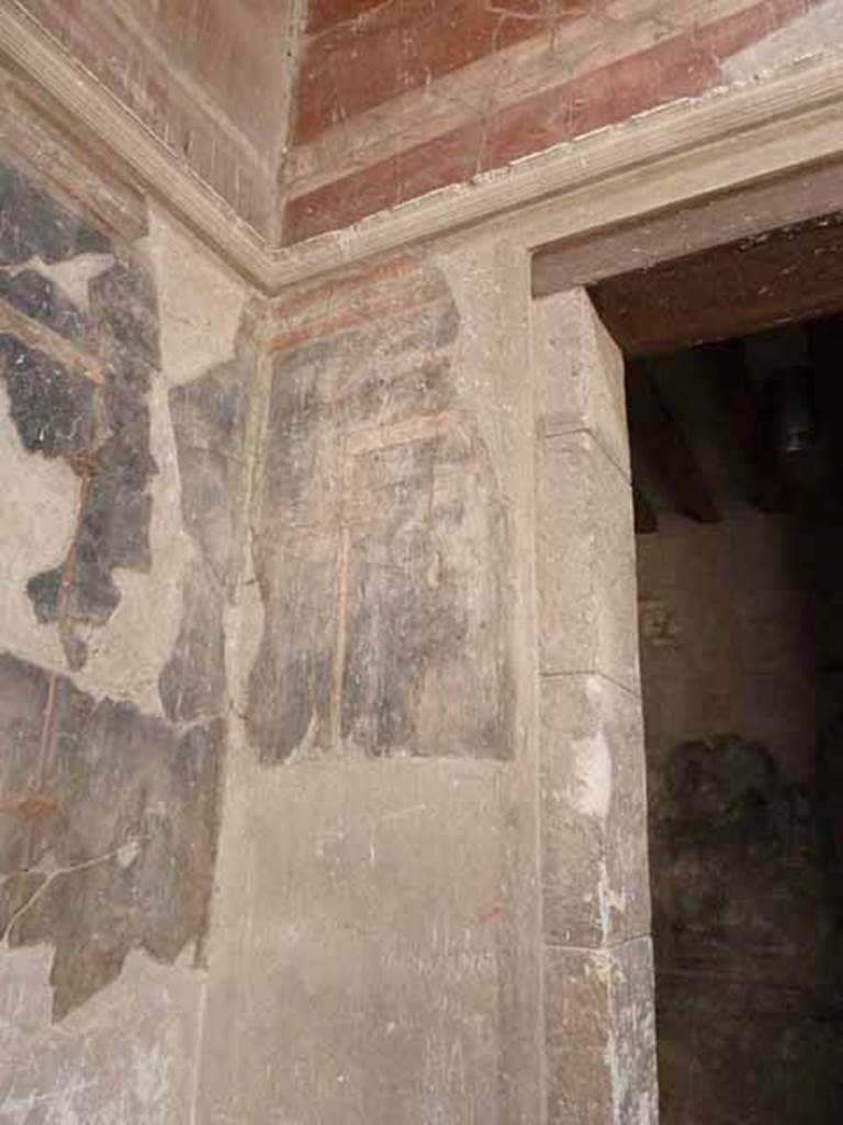 III.11 Herculaneum. May 2010. Room 6, detail of painted decoration in south-east corner of atrium, near doorway to room 4, on right.