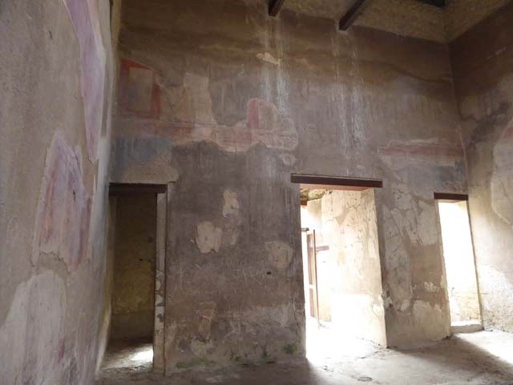 III.16, Herculaneum, October 2014. Room 9, east wall of atrium, with doorway to room 3 in north-east corner, on left.  Photo courtesy of Michael Binns.
