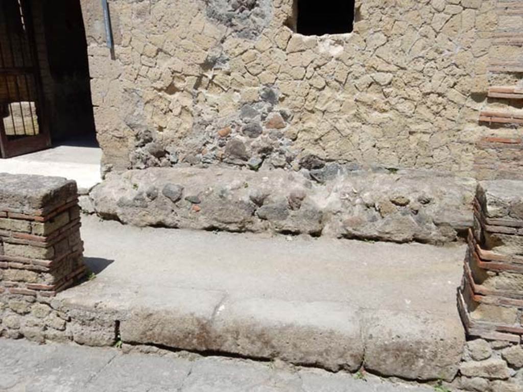 III.16, Herculaneum, May 2018. Bench on north side of entrance doorway. Photo courtesy of Buzz Ferebee