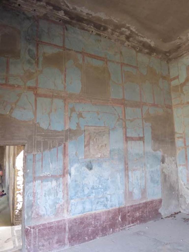 IV.2/1, Herculaneum, September 2016. Central exedra 9, looking towards north wall.
The narrow corridor leading north along the east portico, is on the left. 
Photo courtesy of Michael Binns.
