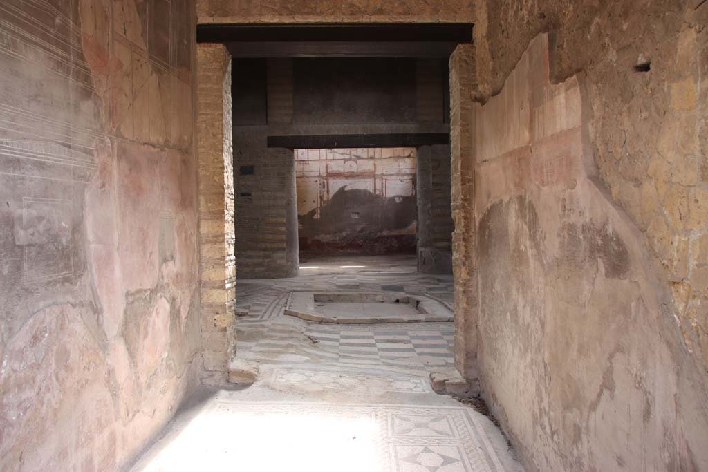 Cardo IV Inferiore, Herculaneum. October 2014. Looking north along east side, with doorway to IV.2.  Photo courtesy of Michael Binns.
