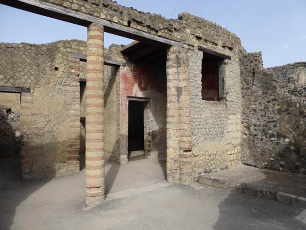 IV.4, Herculaneum, October 2014. Open courtyard 6, looking north-west towards doorway to room 4.  Photo courtesy of Michael Binns.
