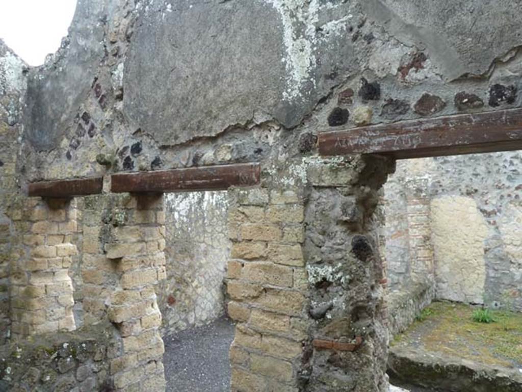 IV.4 Herculaneum. September 2015. Room 14, looking towards south wall and doorway and window across corridor 11 into courtyard 12. On the left is the doorway in the south wall of room 15. 
