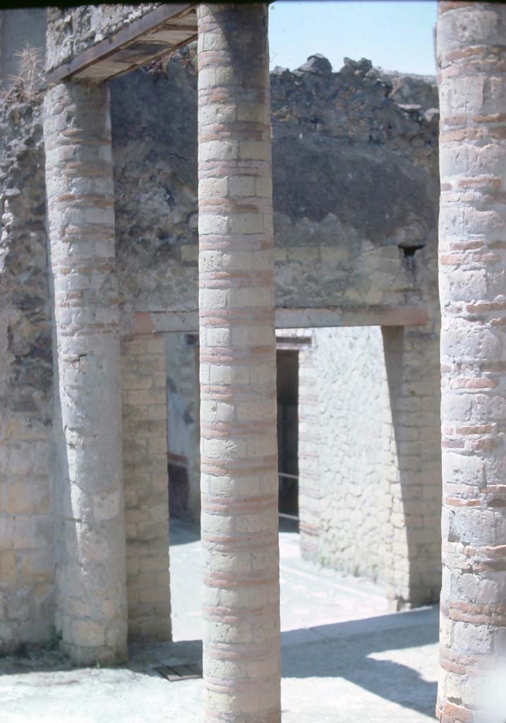 IV.4 Herculaneum. 7th August 1976. Looking south-west through Courtyard 3 into large vestibule 17.
Photo courtesy of Rick Bauer, from Dr George Fays slides collection.
