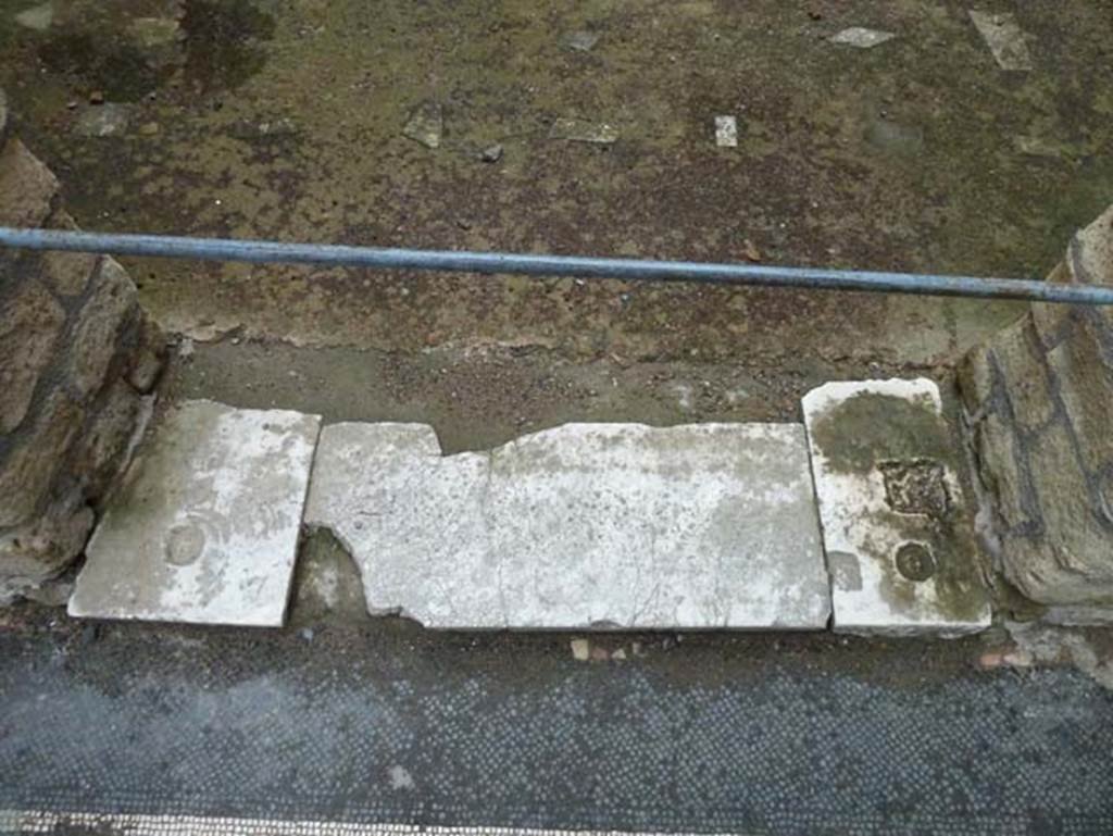 IV.4 Herculaneum. September 2015. Room 18, threshold of doorway to services room.