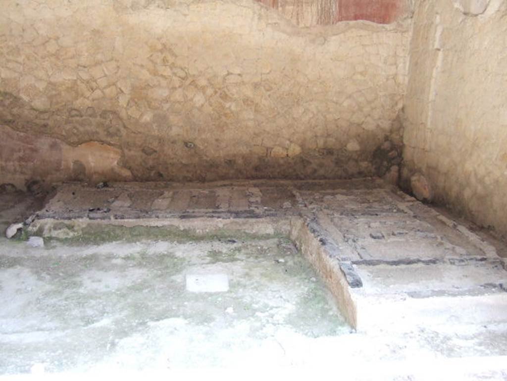 IV.4 Herculaneum. May 2006. Room 19, looking west towards the remains of the two-sided wooden couch.   