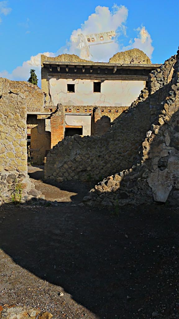 IV.6, Herculaneum, photo taken between October 2014 and November 2019. 
Looking west from room 8, atrium at rear of house, across room 4, tablinum/triclinium, towards entrance corridor.
Photo courtesy of Giuseppe Ciaramella.
