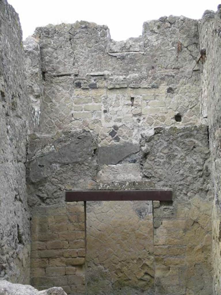 IV.11, Herculaneum, May 2005. 
Looking towards south wall of small cubiculum with doorway to a corridor and small window above it. 
In the rear wall of the corridor another window can be seen, which would have taken light from the small courtyard/lightwell of IV.8.
Photo courtesy of Nicolas Monteix.
