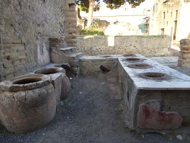 Ins. IV.16 and 15, Herculaneum, September 2015. Looking north-west across bar, from IV.16 towards doorway at IV.15 on Decumanus Inferiore.