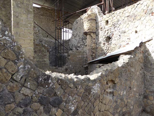 IV.19 Herculaneum. October 2014. Looking south-east towards part of the rear rooms, from south wall of triclinium 16, in IV.4. Photo courtesy of Michael Binns. 
