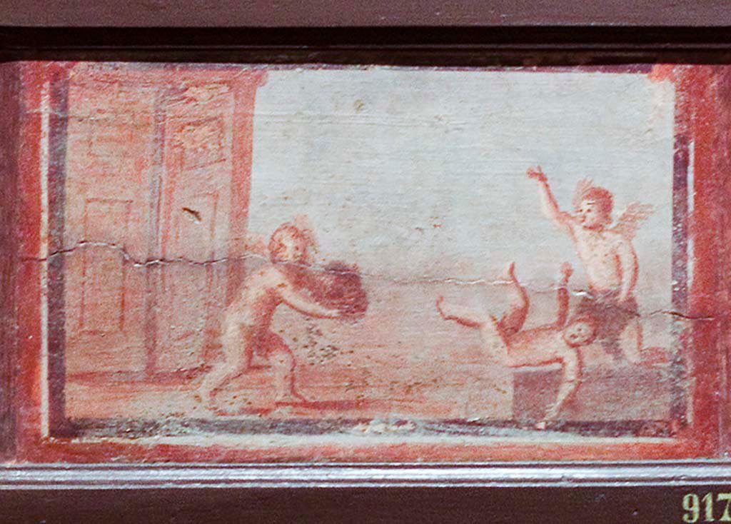 IV.21, Herculaneum. Small painting of 3 cupids, one with a mask. 
Now in Naples Archaeological Museum. Part of inventory number 9177.
