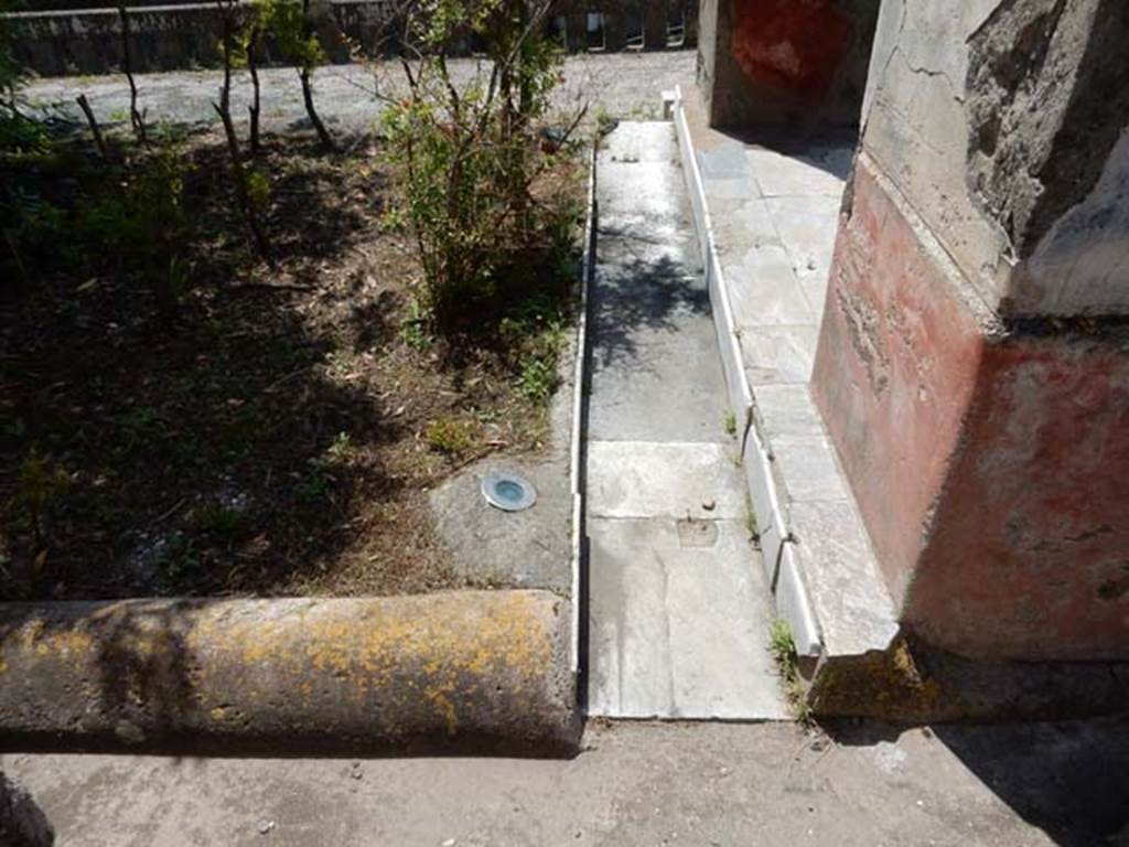 IV.21, Herculaneum. May 2018. Looking south across east garden terrace with pilasters of room 18, on right. 
Photo courtesy of Buzz Ferebee. 

