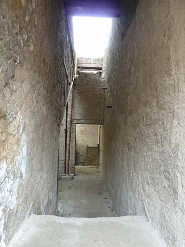 V.2, Herculaneum. May 2010. View from doorway, above stone steps, which would have been the steps to upper floor.