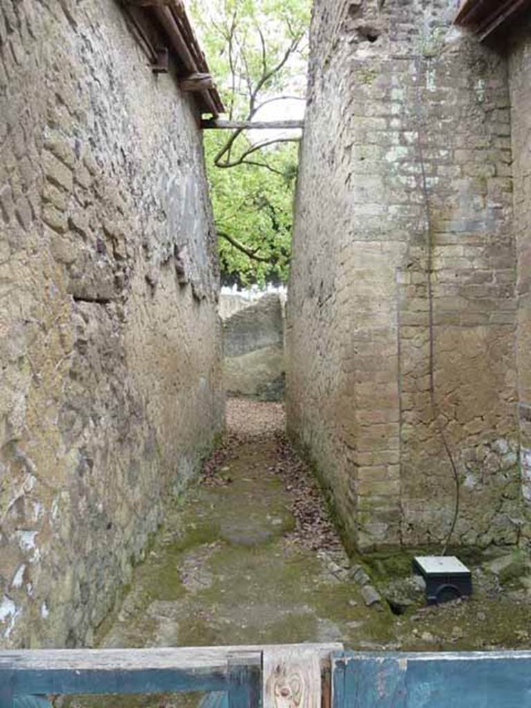 Ins. V.3. May 2010. Looking east along entrance corridor. According to Wallace-Hadrill, this entrance leads to the dwelling area of the property which would have had seven rooms and a peristyle courtyard with four-sided colonnade.
See Wallace-Hadrill, A., 1994. Houses and Society in Pompeii and Herculaneum. New Jersey: Princeton U.P. (p.201)
