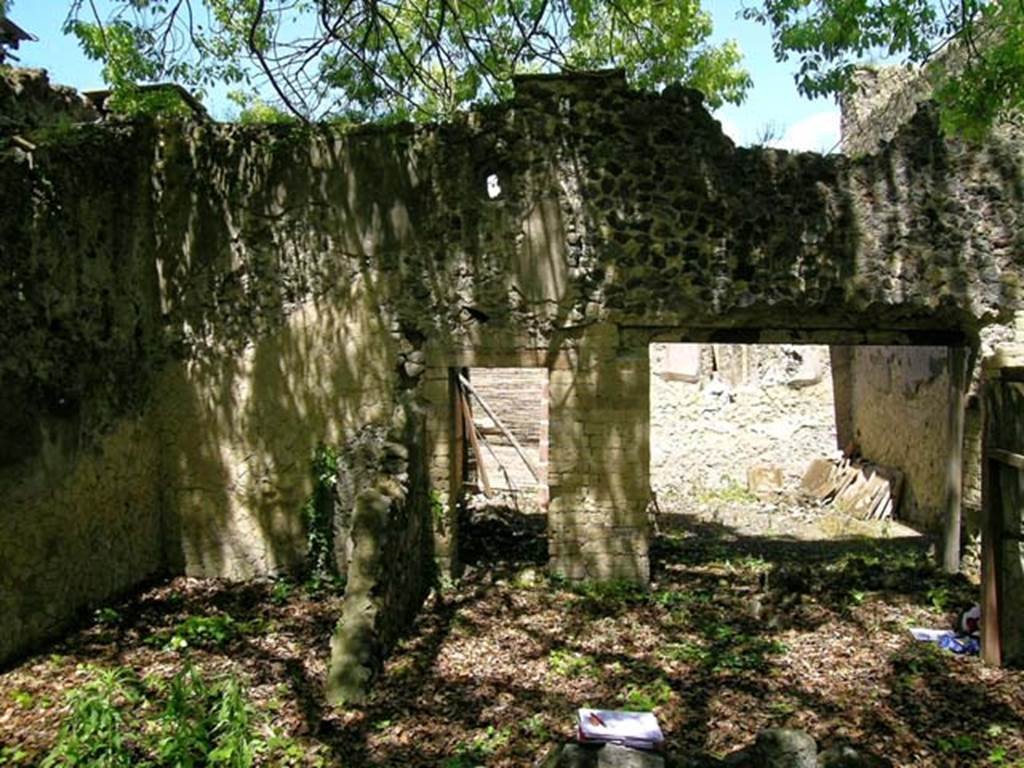 V.4, Herculaneum, May 2004, Room E, on left, and Room D, lower right.
Looking west towards doorway to corridor A, in centre, and doorway to room C, on right.
Photo courtesy of Nicolas Monteix.
