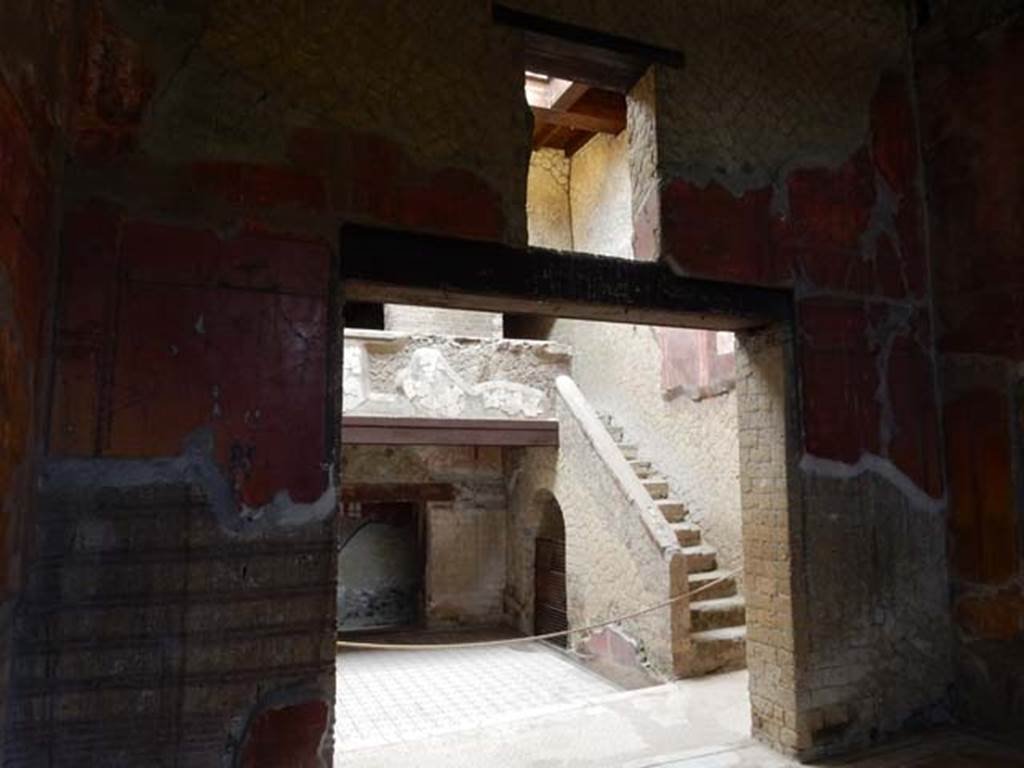 V.8 Herculaneum. May 2018. Room 7, looking through central doorway in north wall towards stairs in area 4.
Photo courtesy of Buzz Ferebee.
