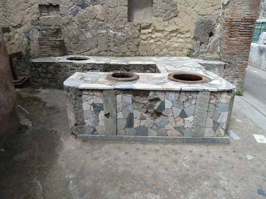 V. 10, Herculaneum, May 2010. Looking towards west wall of shop-room.