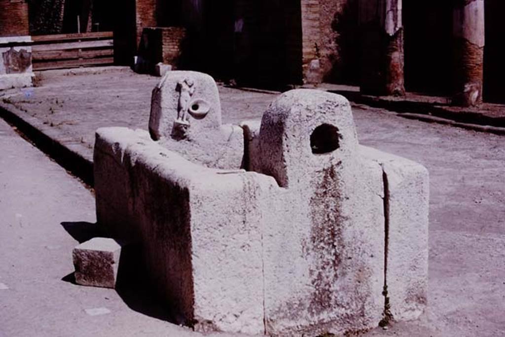 Fountain on Decumanus Maximus with the figure of Venus, Herculaneum. 1975. 
Photo by Stanley A. Jashemski.   
Source: The Wilhelmina and Stanley A. Jashemski archive in the University of Maryland Library, Special Collections (See collection page) and made available under the Creative Commons Attribution-Non Commercial License v.4. See Licence and use details. J75f0705
