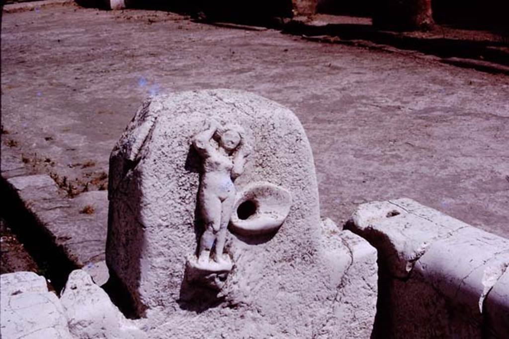 Fountain on Decumanus Maximus with the figure of Venus, Herculaneum. 1975. 
Photo by Stanley A. Jashemski.   
Source: The Wilhelmina and Stanley A. Jashemski archive in the University of Maryland Library, Special Collections (See collection page) and made available under the Creative Commons Attribution-Non Commercial License v.4. See Licence and use details. J75f0706
